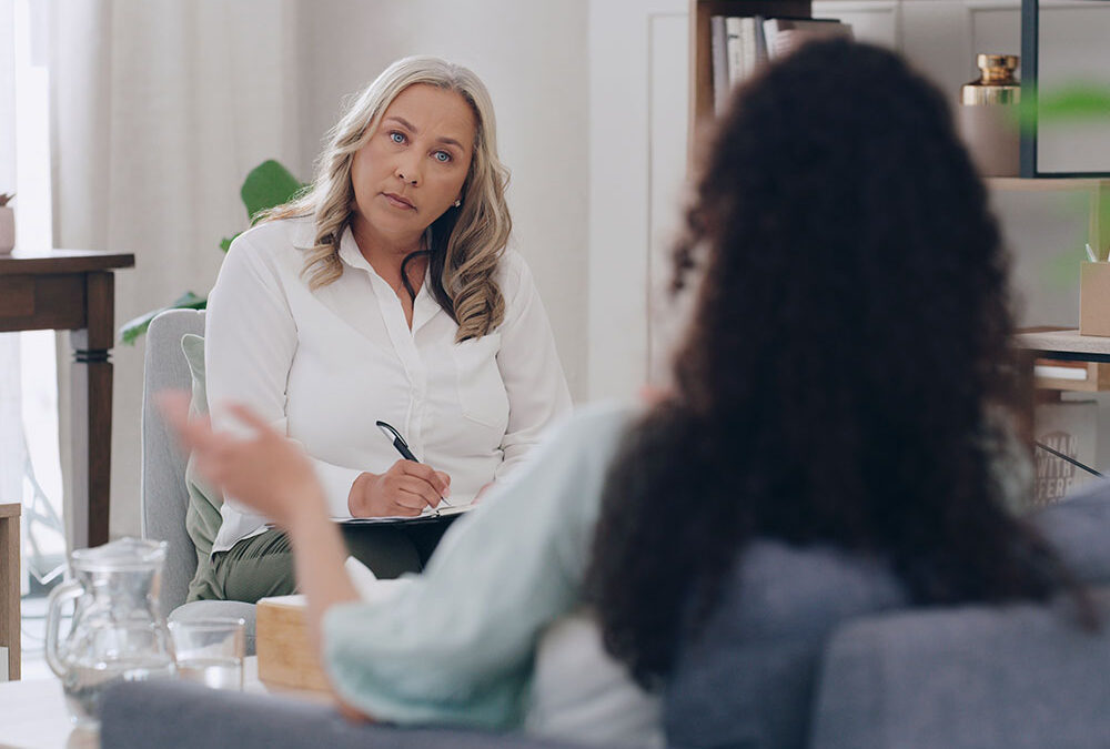 case manager sitting in office with a patient