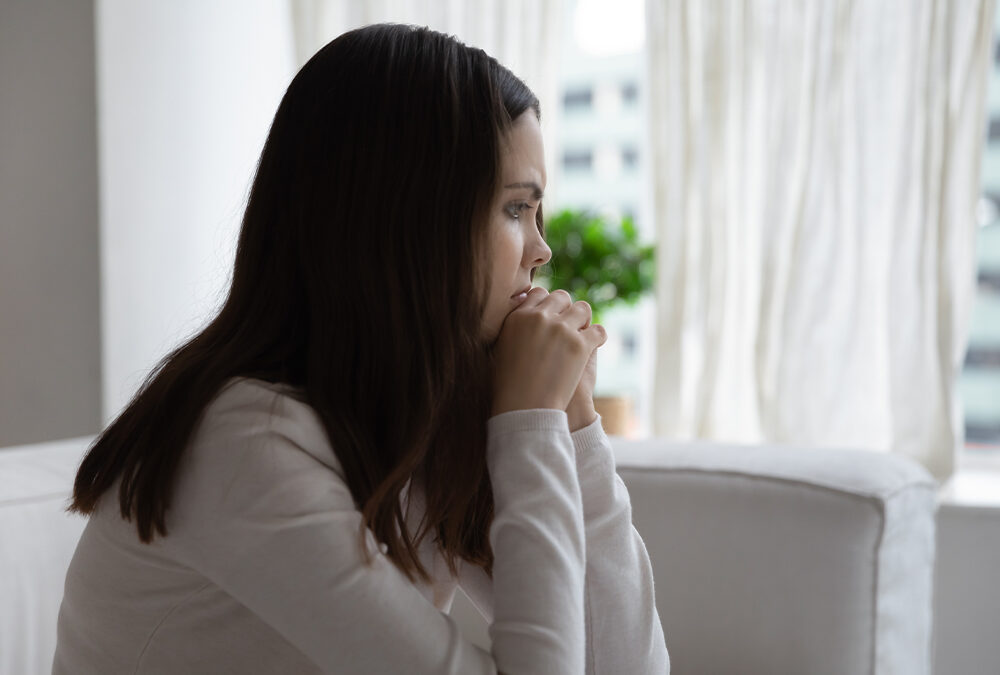 sad girl dealing with bipolar staring out the window